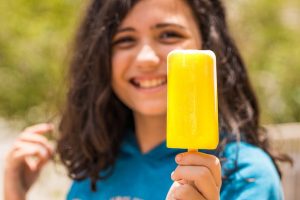 Girl with fruit popsicle