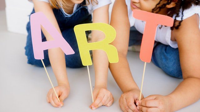 Kids doing arts and crafts inside