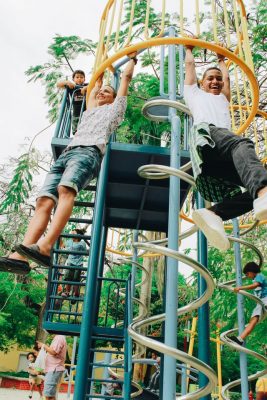 Kids on playground climbing frame