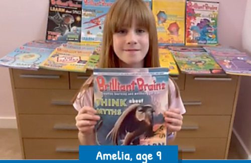 Amelia aged 9 with her collection of education or edutainment magazines
